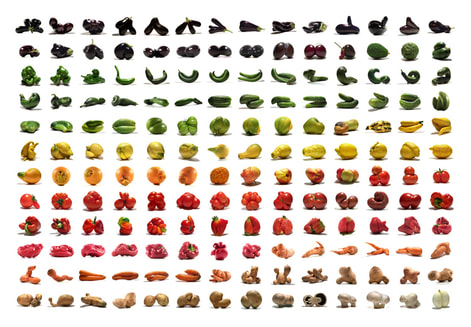 Grid of differently shaped and colored potatoes in rainbow order.